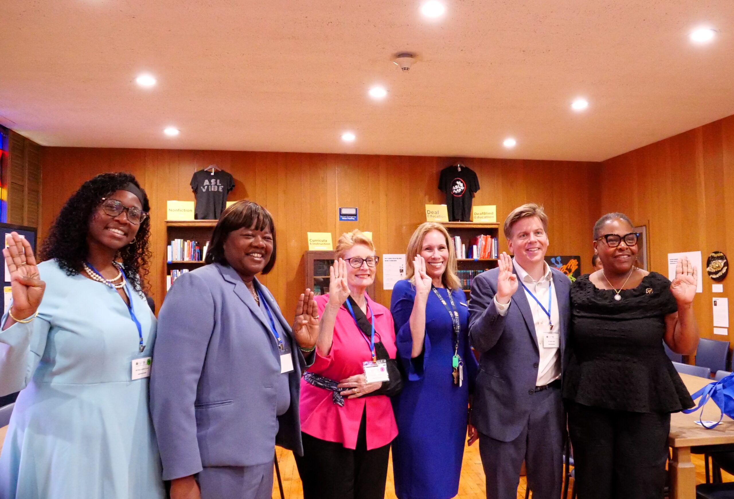 A group of guests and New York State Assembly members gathered together at the opening of the Deaf and DeafBlind Museum and Research Center.